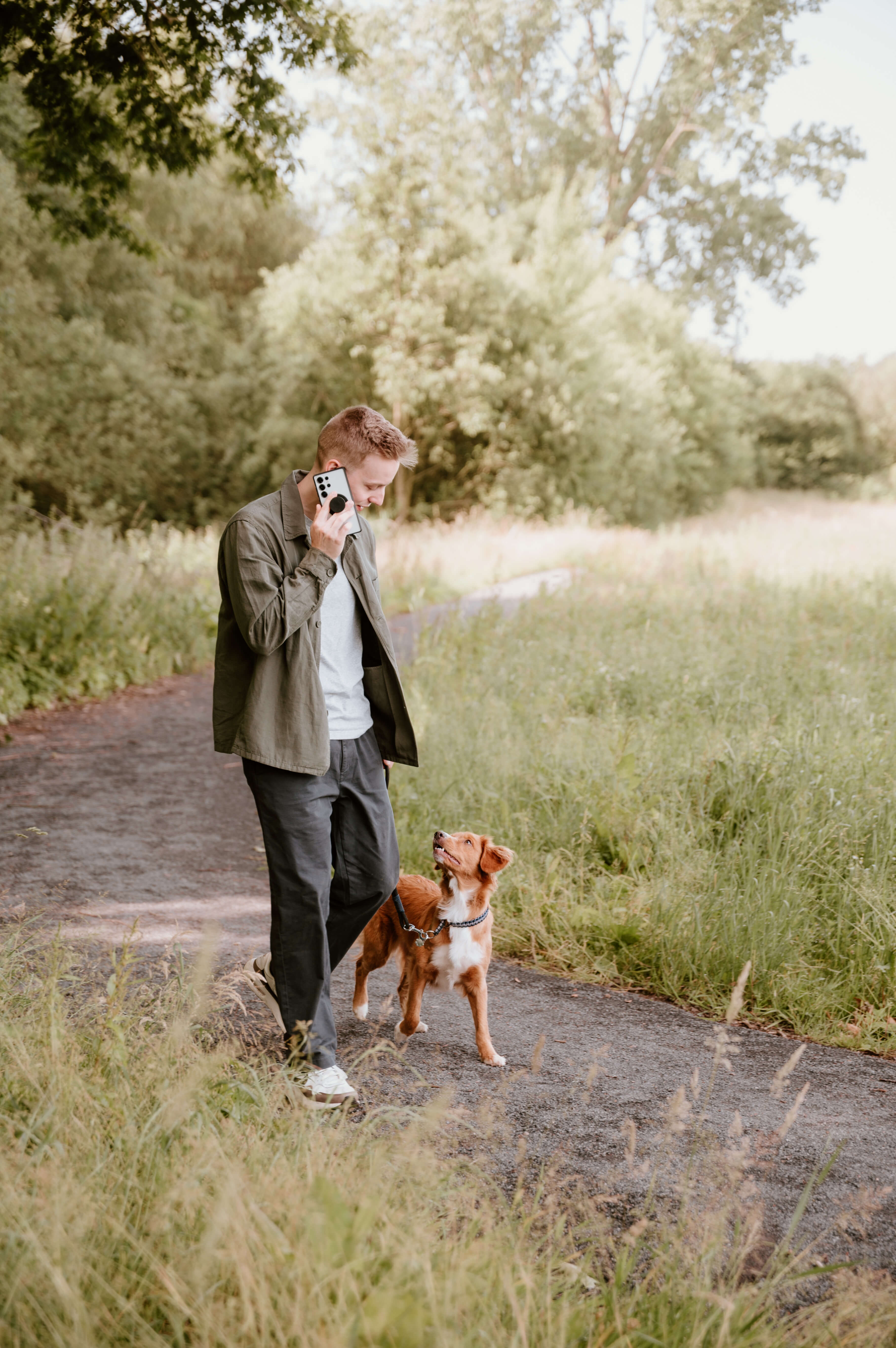 Jasey walking with his dog